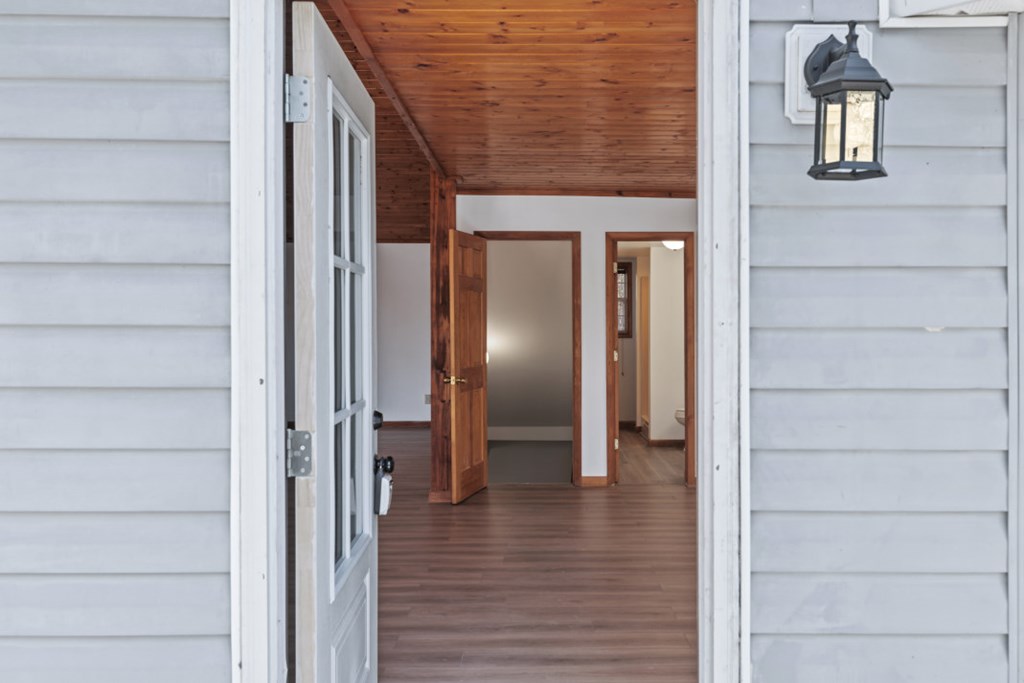 144 River Watch Terrace Murphy, NC 28906 - Photo 4 of 60 a view of a hallway with wooden floor and staircase