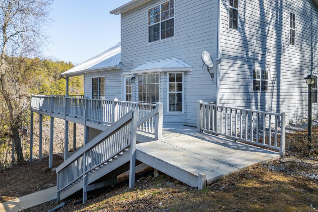 144 River Watch Terrace Murphy, NC 28906 - Photo 42 of 60 a view of house with wooden deck and wooden fence