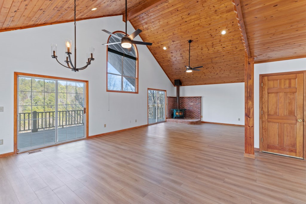 144 River Watch Terrace Murphy, NC 28906 - Photo 7 of 60 a view of an empty room with wooden floor and windows
