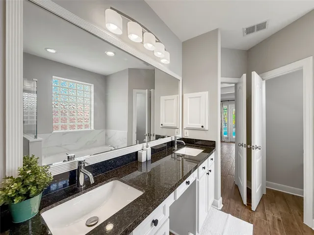 a bathroom with a bathtub a toilet and a shower