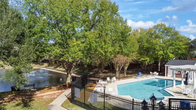 a view of a swimming pool with a patio