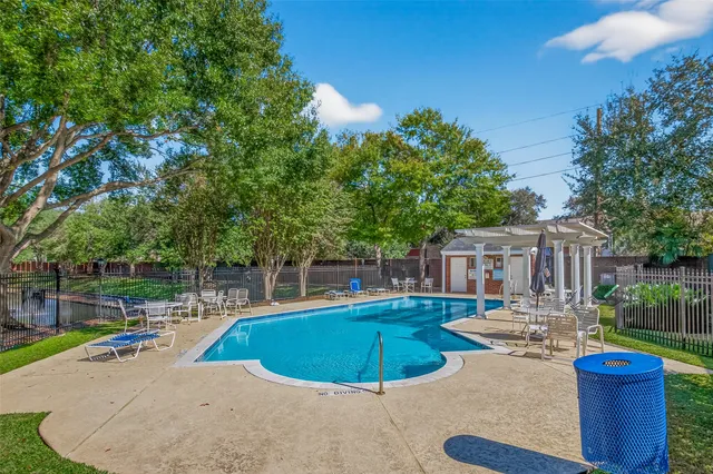 a view of a backyard with sitting area
