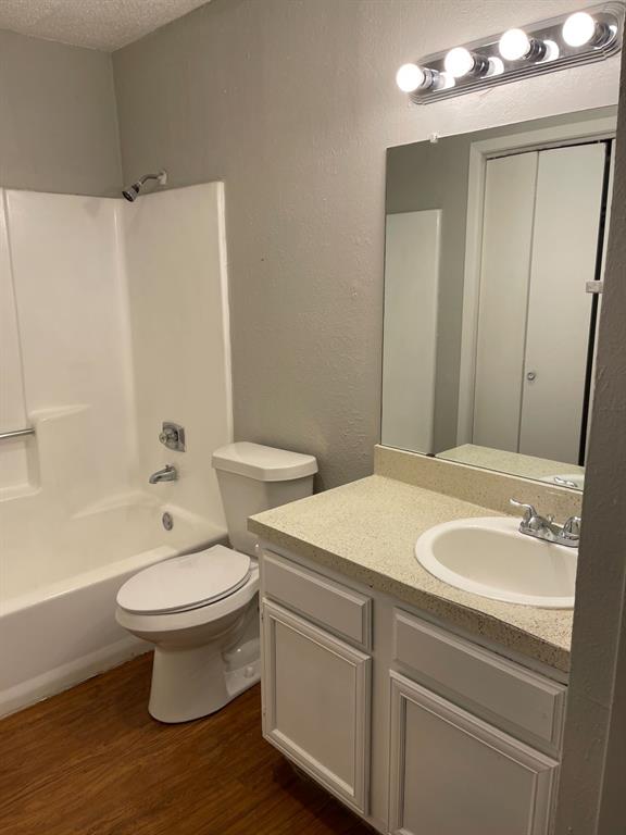 9696 Walnut Street, Unit 1206 Dallas, TX 75243 - Photo 13 of 13 a bathroom with a sink toilet and shower