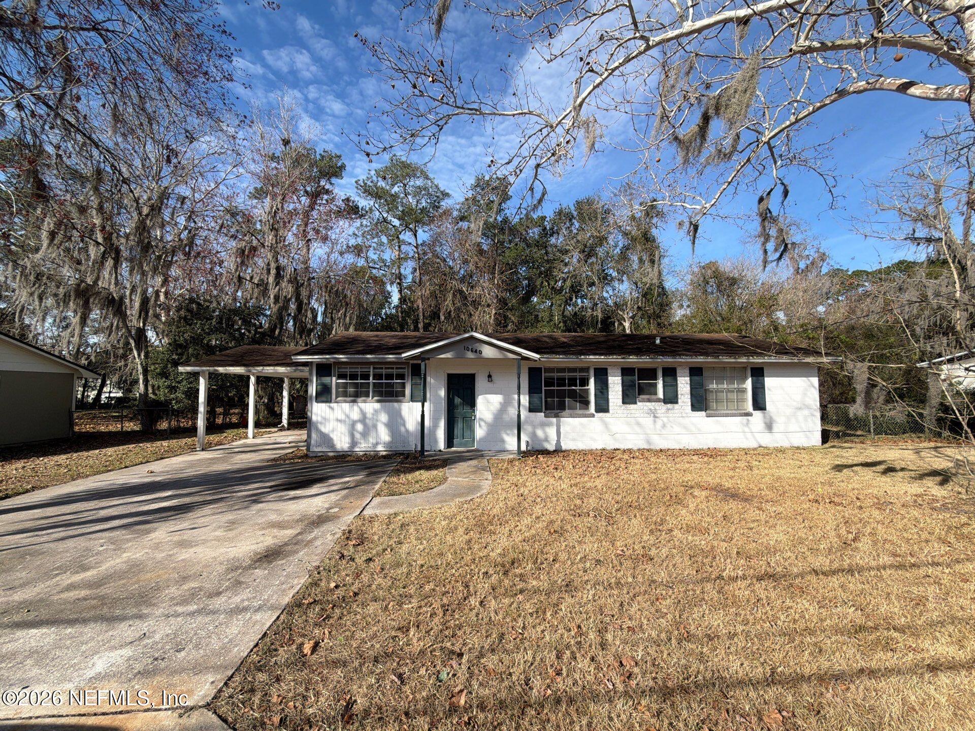 front view of a house with a yard