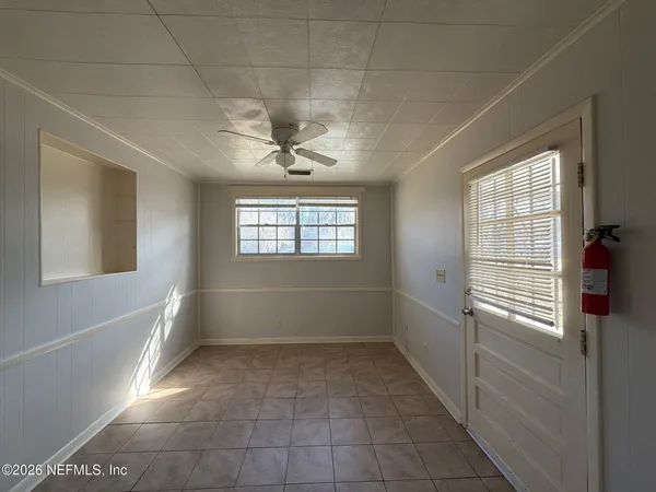 a view of an empty room with a window