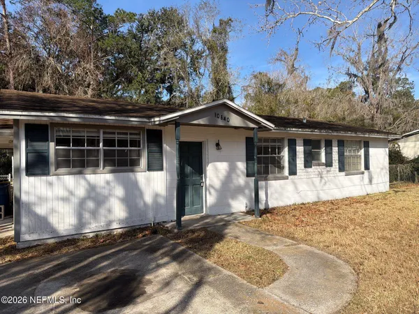 a front view of a house with yard