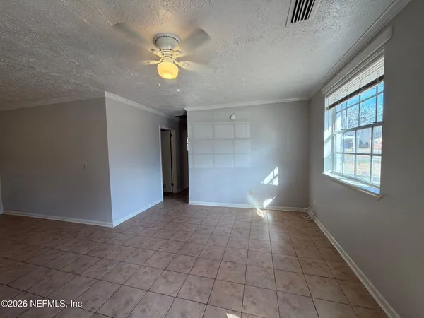 a view of an empty room with a window