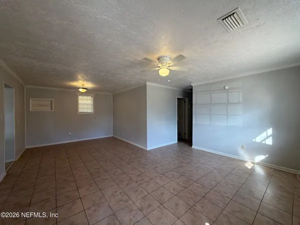 a view of an empty room with a window