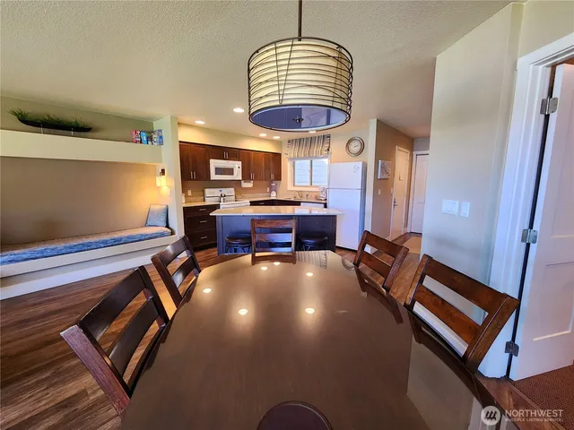 a view of a livingroom with furniture and a window