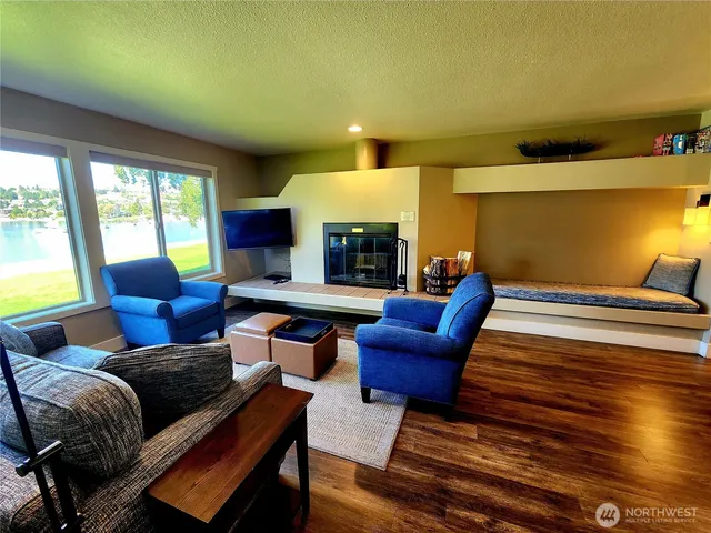 a bedroom with furniture and a fireplace