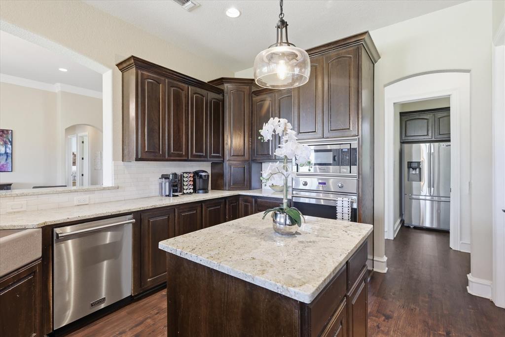 4920 Peden Road Fort Worth, TX 76179 - Photo 10 of 40 Large Kitchen with Updated Lighting, Viking Appliances, and Granite Countertops with Large Walk in Pantry and Dry Bar.
