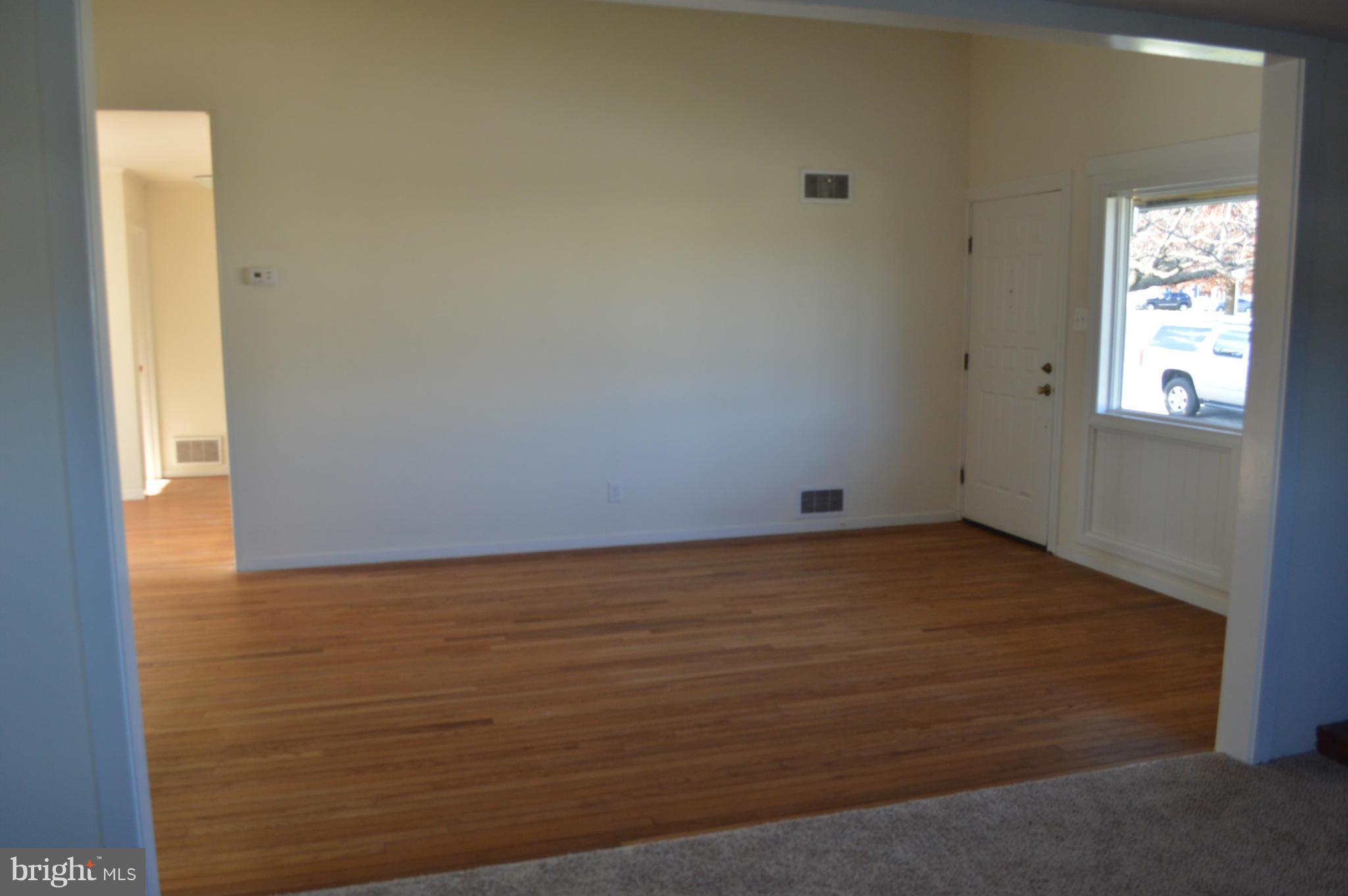 7605 Merritt Point Road Baltimore, MD 21222 - Photo 8 of 13 a view of empty room with window