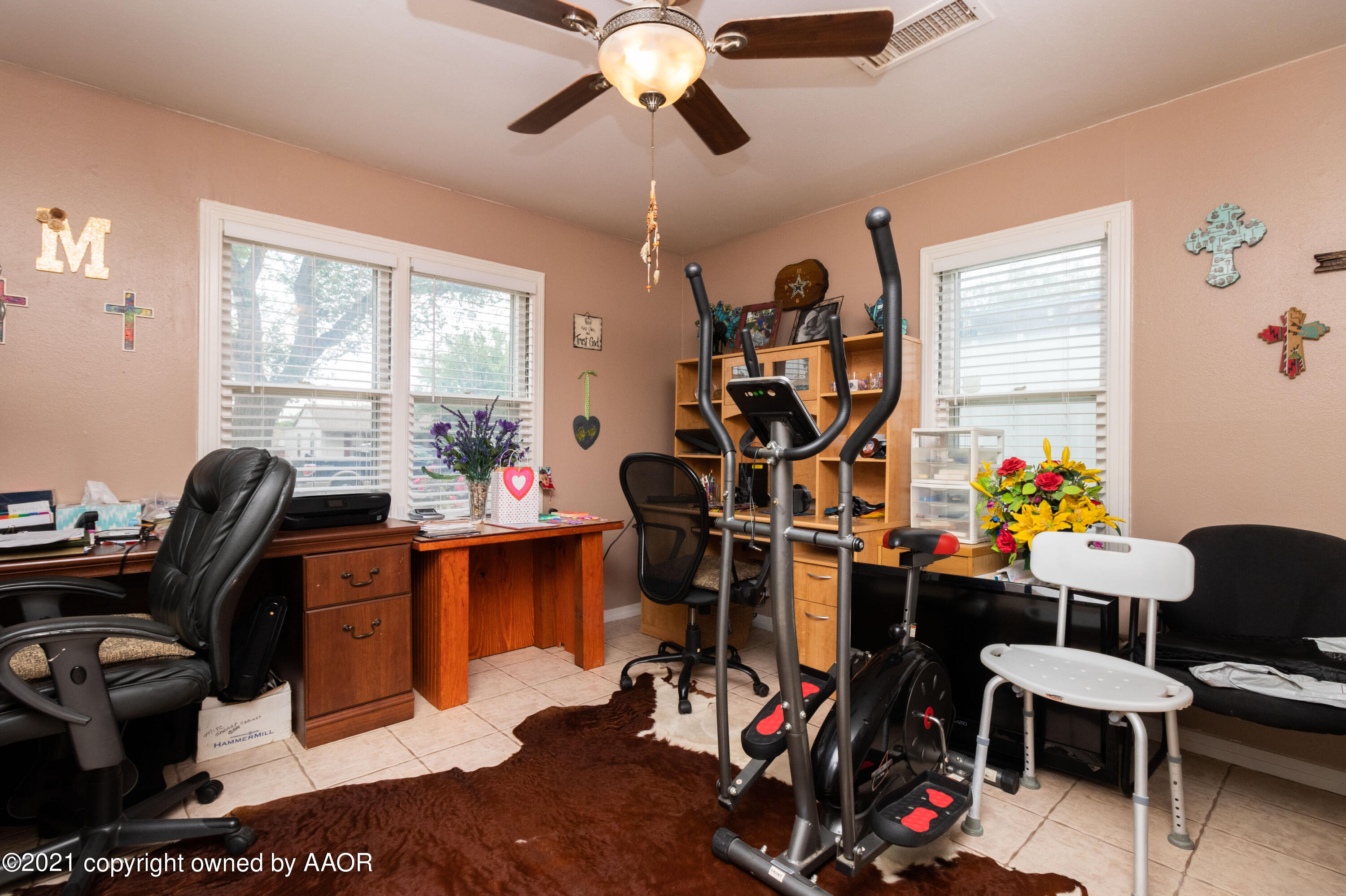4600 Parker Street Amarillo, TX 79110 - Photo 15 of 28 a view of a workspace with furniture and a window