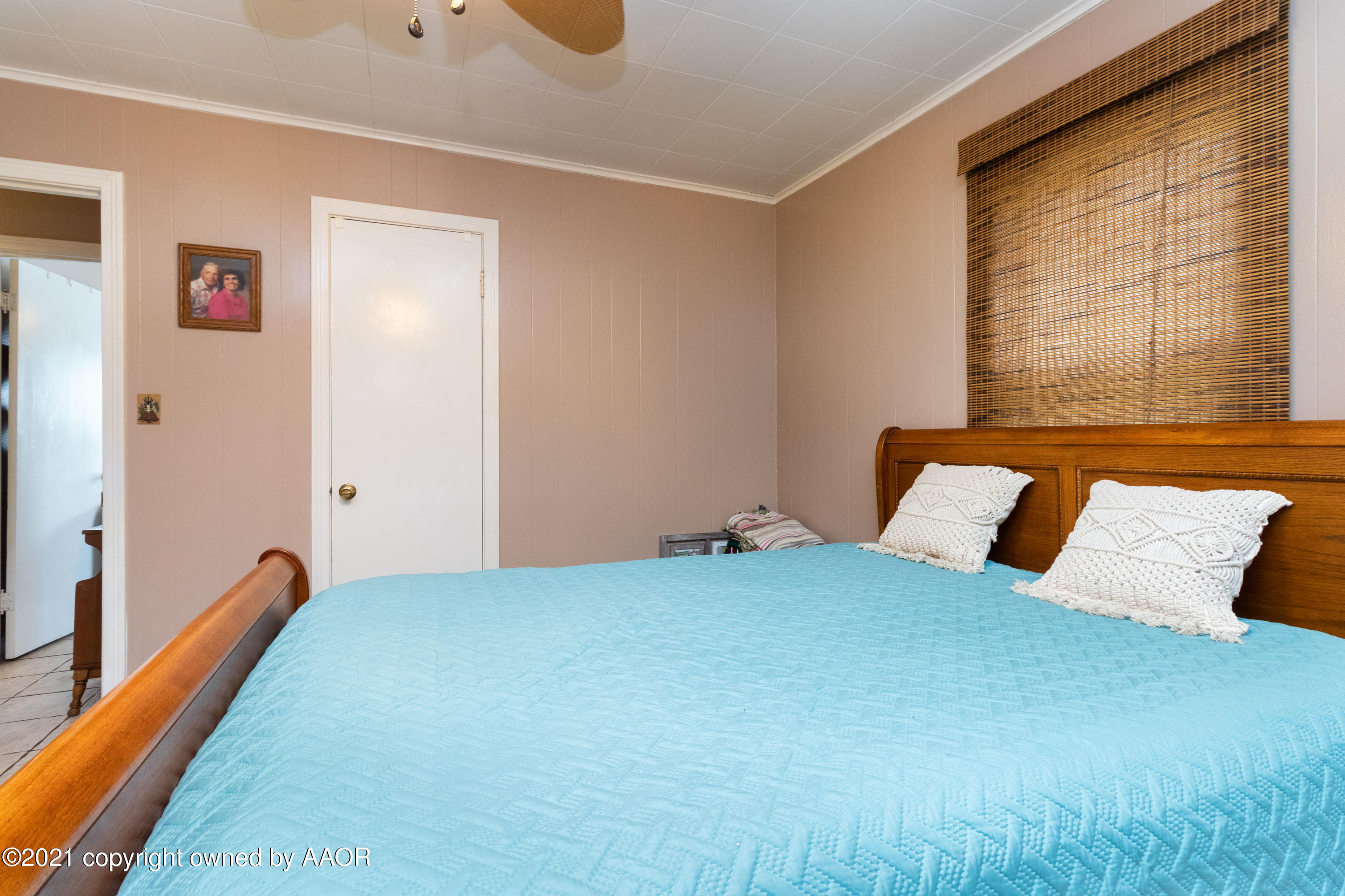 4600 Parker Street Amarillo, TX 79110 - Photo 18 of 28 a bedroom with a bed and a large window
