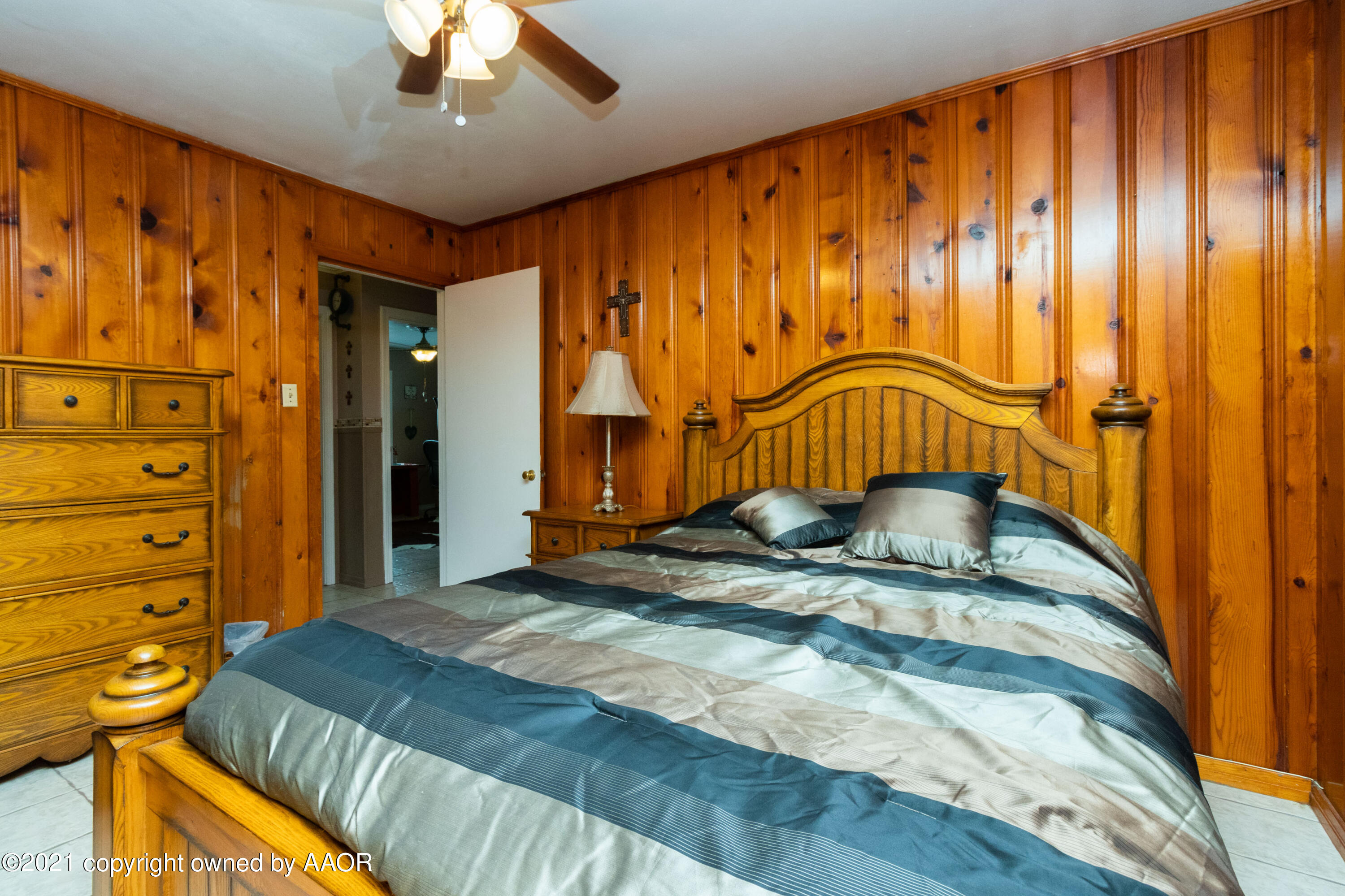 4600 Parker Street Amarillo, TX 79110 - Photo 20 of 28 a bedroom with a bed and a dresser