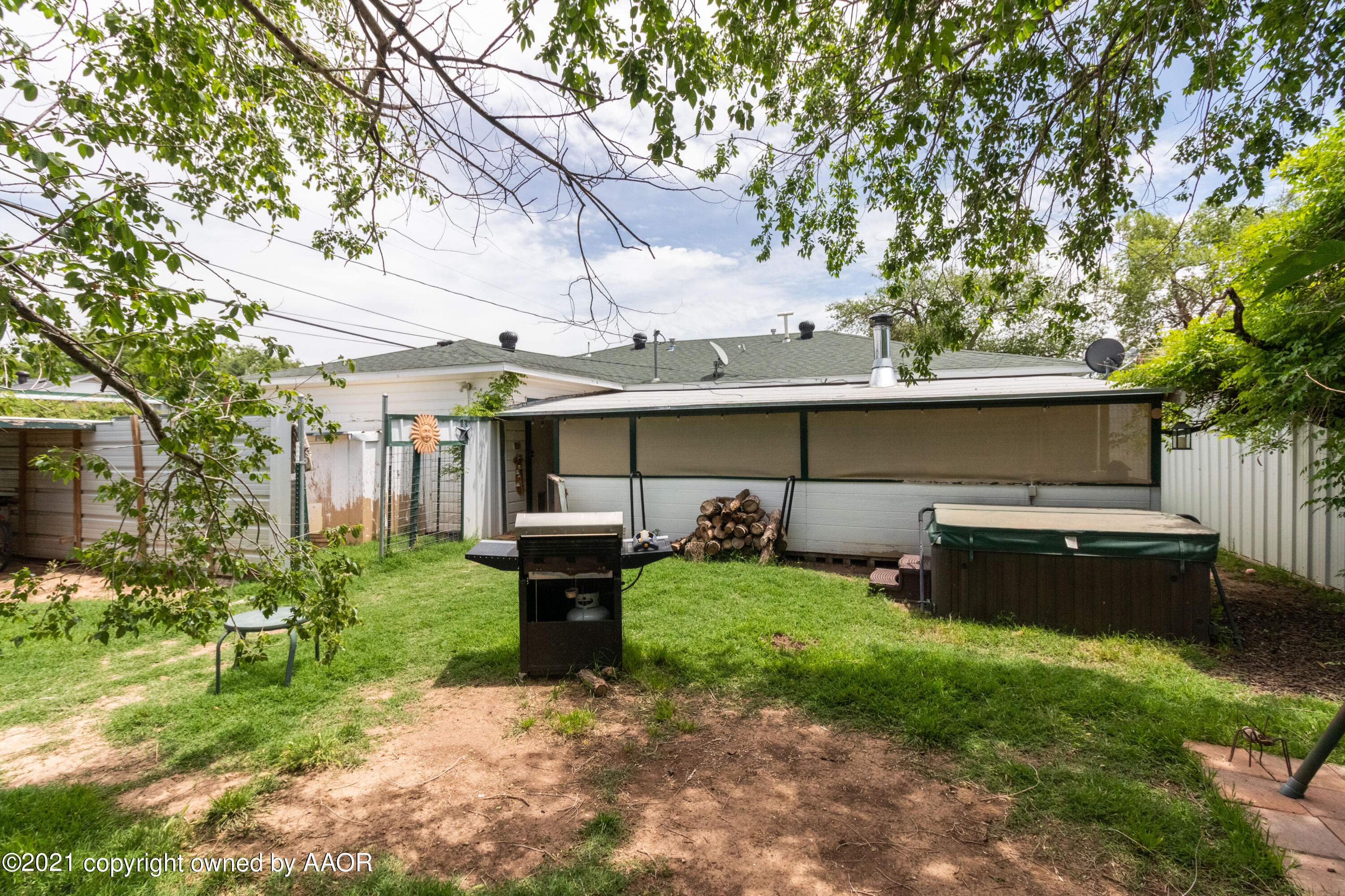 4600 Parker Street Amarillo, TX 79110 - Photo 27 of 28 a view of a house with backyard sitting area and garden