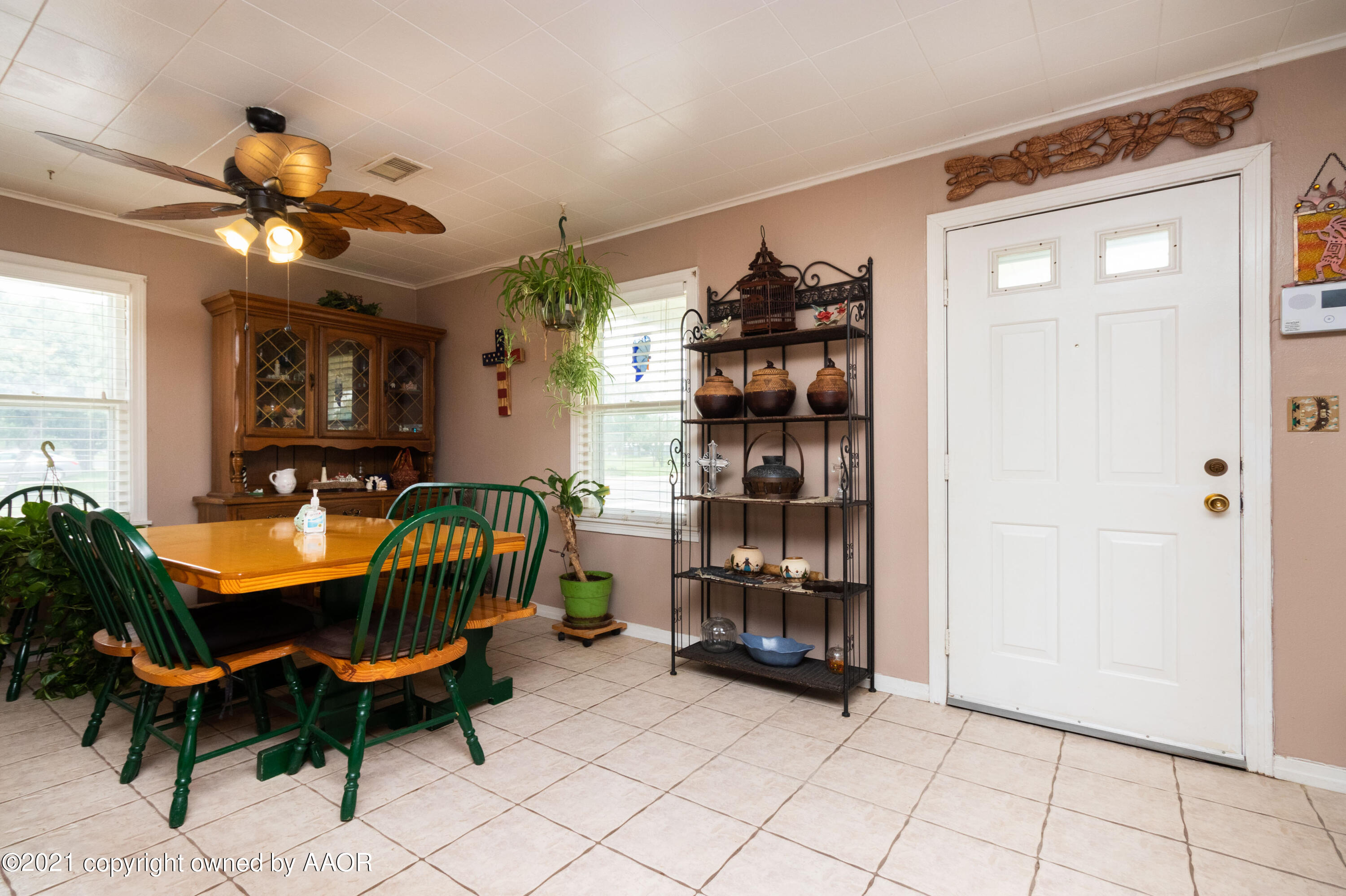 4600 Parker Street Amarillo, TX 79110 - Photo 4 of 28 a living room with furniture a dining table and chairs
