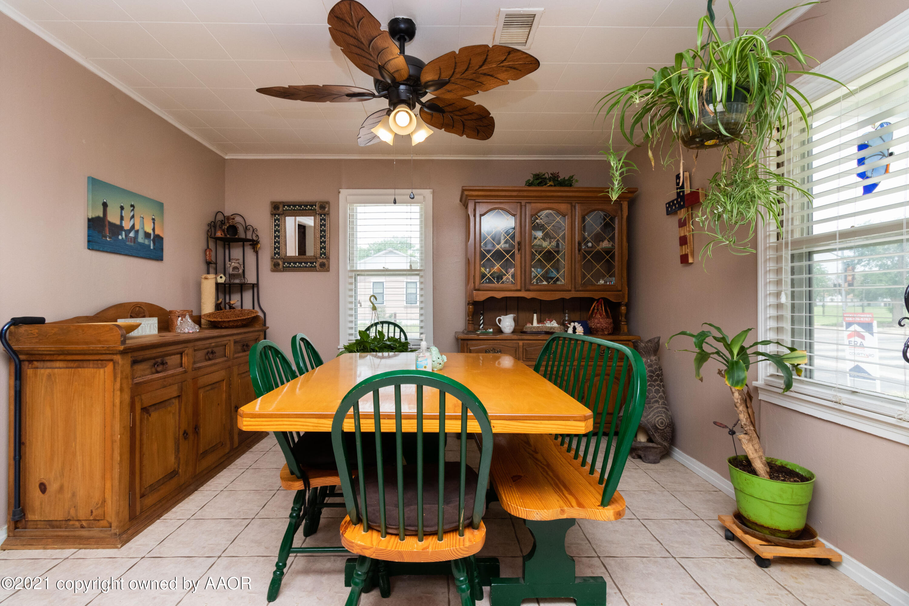 4600 Parker Street Amarillo, TX 79110 - Photo 5 of 28 a view of a dining room with furniture and a chandelier