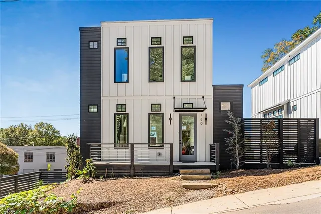 a view of a brick building with many windows