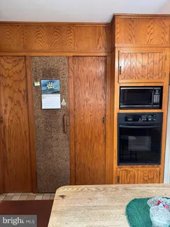 a bedroom with a bed and a fireplace