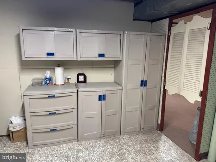 a view of a backyard with table and chairs and wooden fence