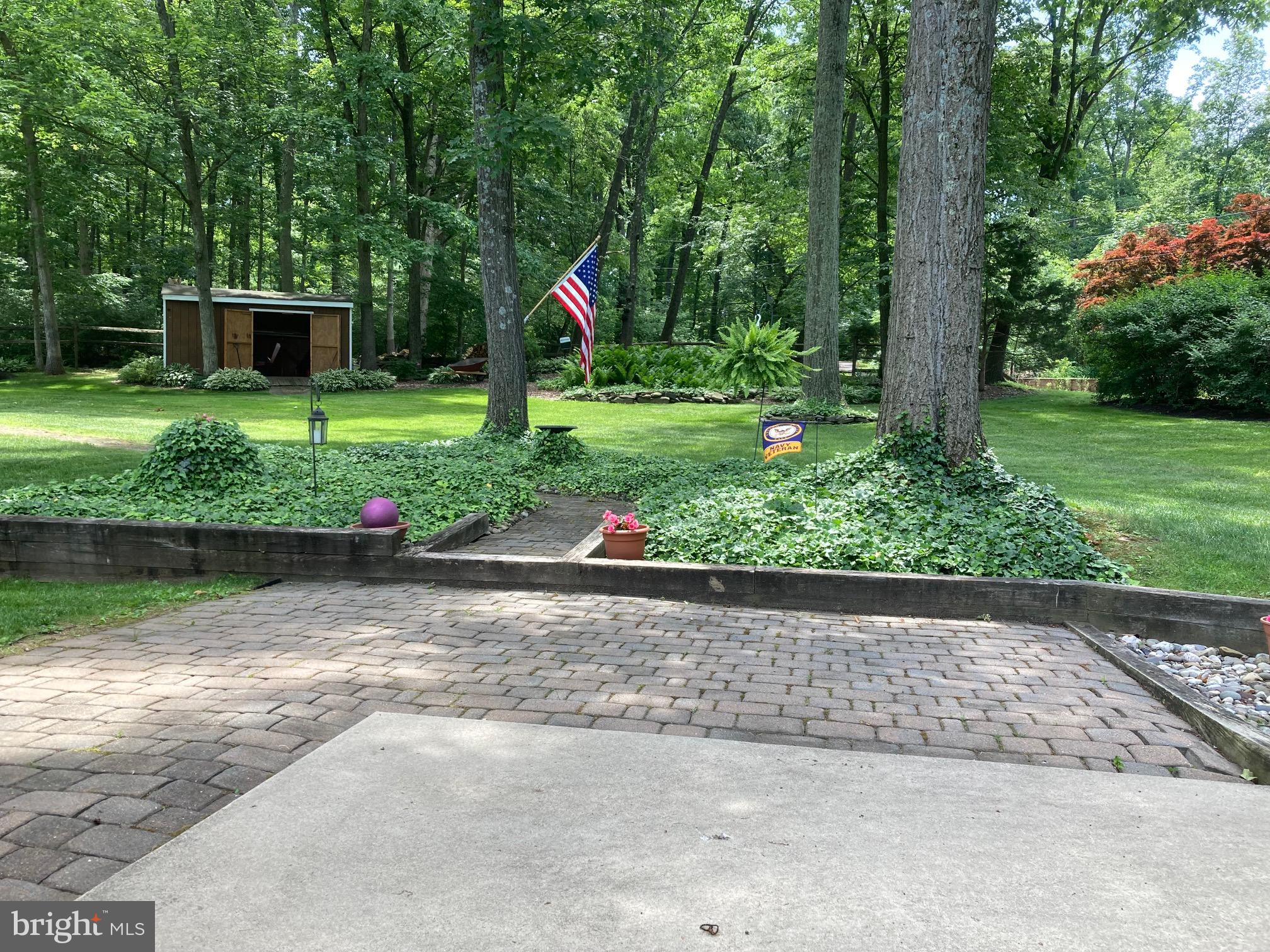 30 Hollow Road Telford, PA 18969 - Photo 33 of 38 a view of a backyard with plants and a patio
