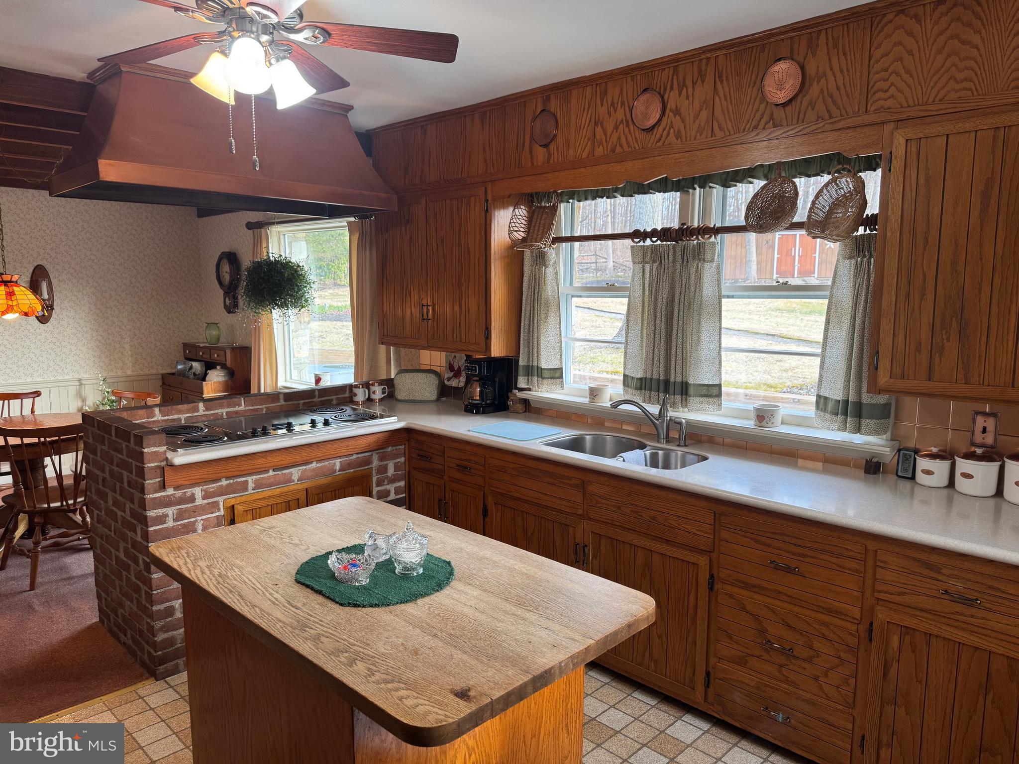 30 Hollow Road Telford, PA 18969 - Photo 7 of 38 a kitchen with a sink a window and chairs