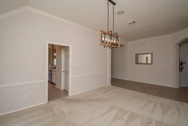 a bedroom with a bed a couch and a large window