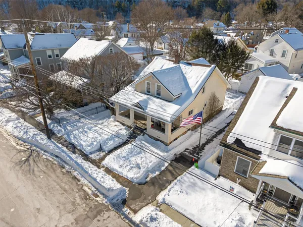 an aerial view of multiple houses with yard