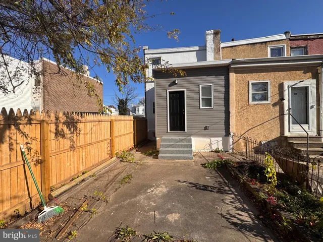 a front view of a house with parking