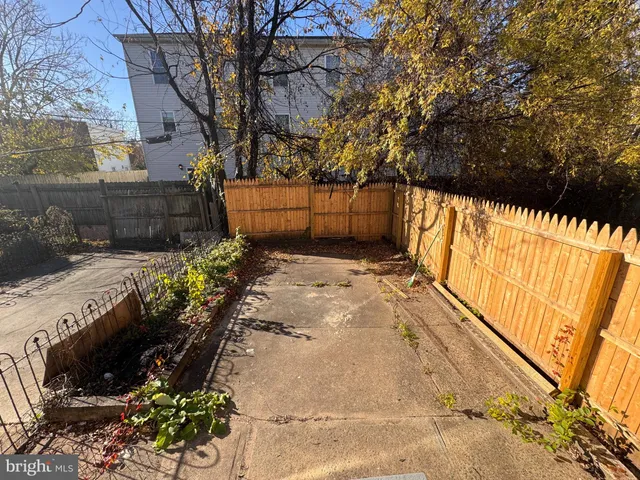 a view of a backyard of the house