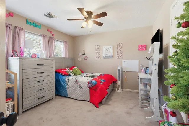 a bedroom with a bed and a dresser