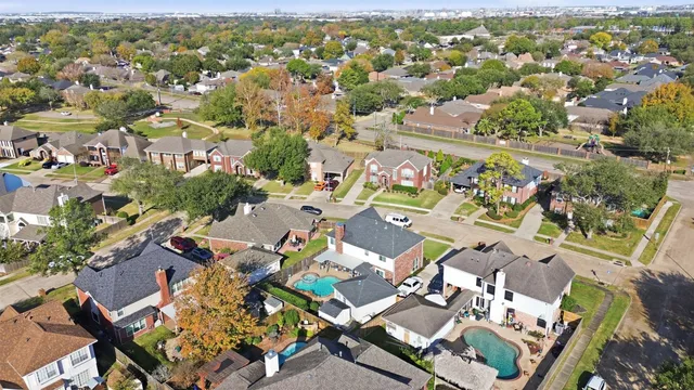 an aerial view of a city with lots of residential buildings