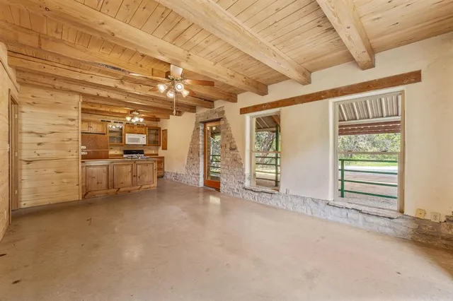 a kitchen that has a sink and a stove