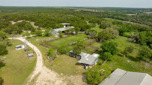a view of a green field with an outdoor space