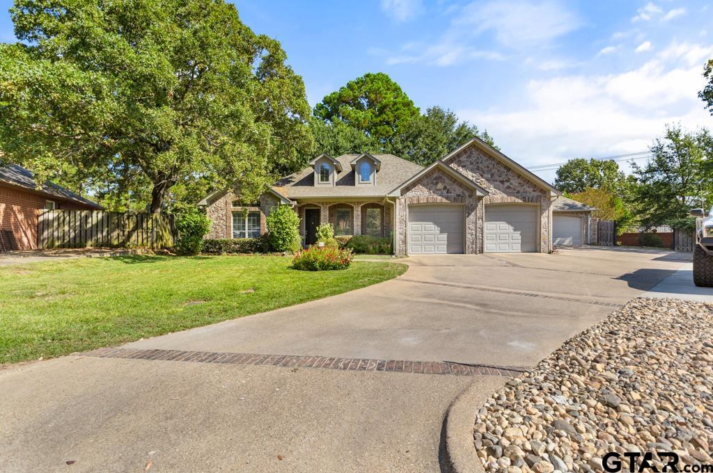 a view of house with yard