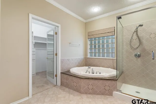 a bathroom with a tub and shower