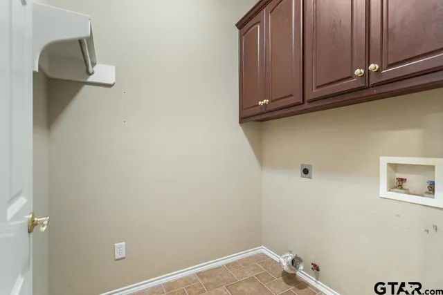 a view of potted plants next to a brick building