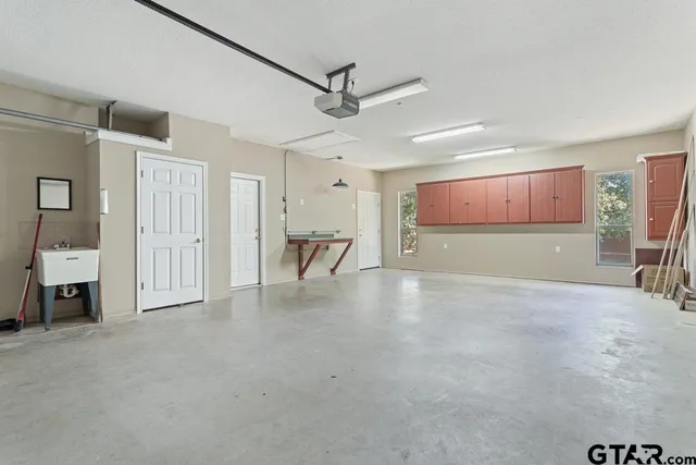 a view of an empty room with a cabinet