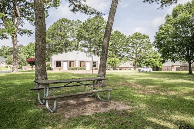 a view of outdoor space with playground and green space
