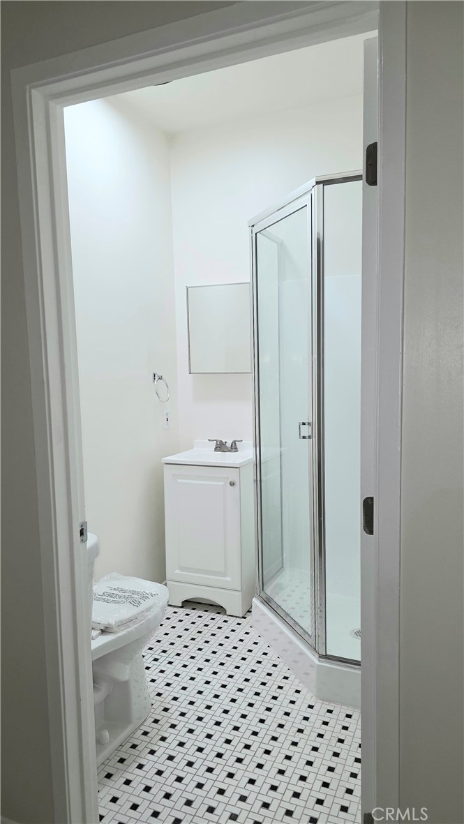 3408 West Sunset, Unit 106 Los Angeles, CA 90026 - Photo 5 of 5 a bathroom with a sink a toilet and shower