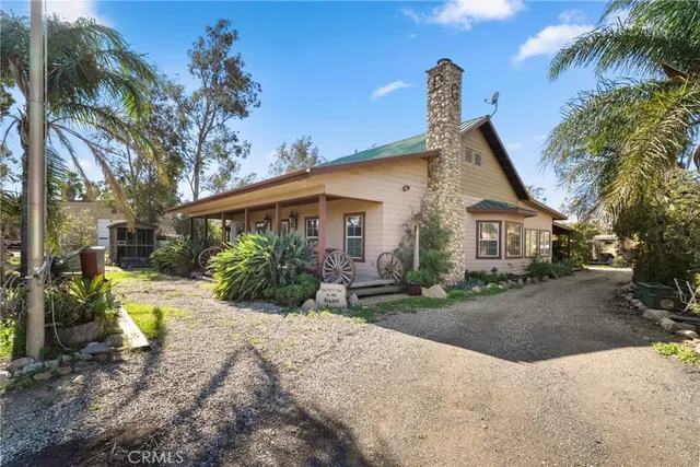 a view of a backyard with potted plants
