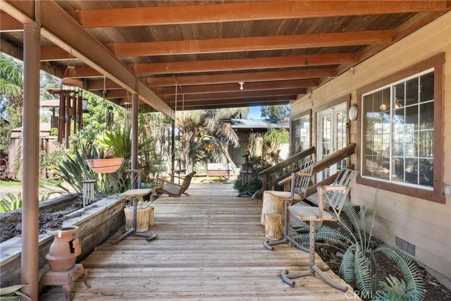 a view of a house with wooden fence