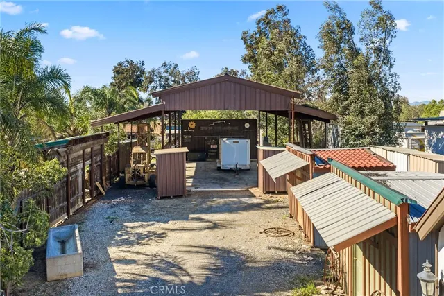 a view of a yard with large trees