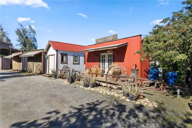 a living room with furniture a fireplace a rug and a large window