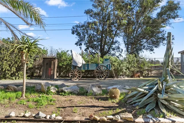 a view of a dining room with furniture a chandelier and wooden floor