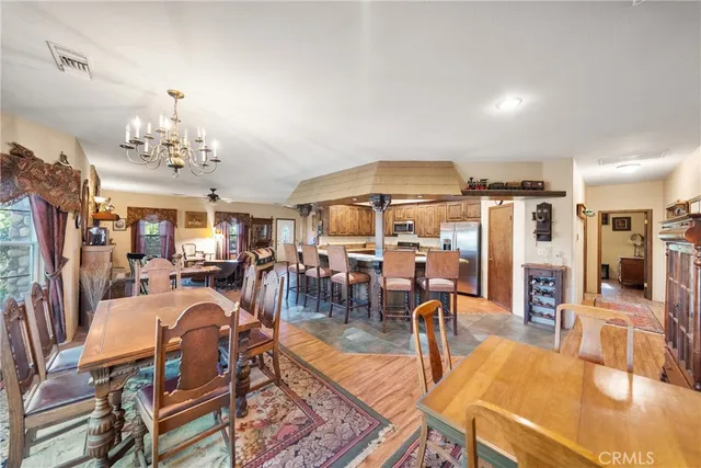 a kitchen with stainless steel appliances granite countertop a refrigerator stove and sink