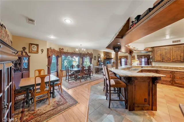 a living room with a bed and a chandelier