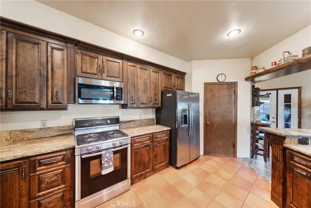 a spacious bathroom with a double vanity sink a mirror and a bathtub