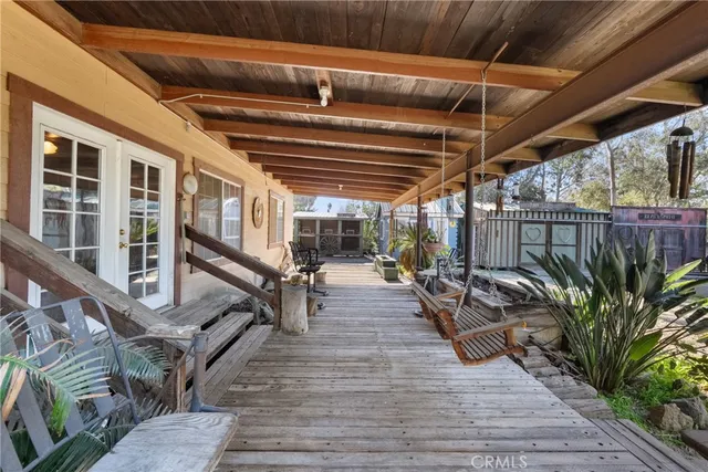 a view of a backyard with sitting area